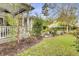 Landscaped backyard with a grassy area and rose bushes at 211 Ilderton St, Summerville, SC 29483