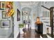 Bright entryway with hardwood floors, chandelier, and staircase at 211 Ilderton St, Summerville, SC 29483