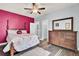 Bedroom with a dark wood dresser and ceiling fan at 211 Ilderton St, Summerville, SC 29483