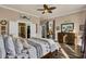 Main bedroom with king bed, ensuite bathroom access, and ample sunlight at 211 Ilderton St, Summerville, SC 29483