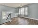 Spacious loft area with hardwood flooring and large window with curtains at 211 Ilderton St, Summerville, SC 29483