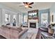 Spacious living room with fireplace, hardwood floors, and comfy seating at 211 Ilderton St, Summerville, SC 29483