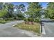 Landscaped entrance to the community with paved roads and lush greenery at 211 Ilderton St, Summerville, SC 29483