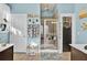 Spa-like bathroom with a walk-in shower, light blue walls and tile floors at 211 Ilderton St, Summerville, SC 29483