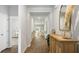Light-filled hallway showcasing a view to the living area at 2215 Macallan Blvd, Ravenel, SC 29470
