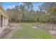 Spacious backyard with a fenced chicken coop and trees at 313 Fairlawn Dr, Moncks Corner, SC 29461