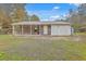 Brick house with metal roof, large windows, and a spacious yard at 313 Fairlawn Dr, Moncks Corner, SC 29461