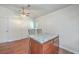 Kitchen island with granite countertop and two barstools at 313 Fairlawn Dr, Moncks Corner, SC 29461