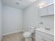Simple bathroom with white vanity and tile floor at 313 Fairlawn Dr, Moncks Corner, SC 29461