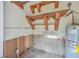 Unfinished workshop with storage shelves and water heater at 313 Fairlawn Dr, Moncks Corner, SC 29461