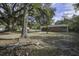 Brick home nestled in a wooded backyard setting with a large oak tree at 804 Chaplin St, Walterboro, SC 29488