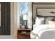 Bedroom features a nightstand and large window with natural light at 819 Recess Pointe Dr # 46, Moncks Corner, SC 29461