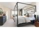 Luxurious main bedroom with a canopy bed and large windows at 819 Recess Pointe Dr # 46, Moncks Corner, SC 29461