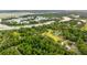 Aerial view showing community tennis courts and surrounding nature at 9004 Topwater Ln, Johns Island, SC 29455