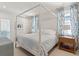 Spacious bedroom with a large canopy bed and plenty of natural light at 9004 Topwater Ln, Johns Island, SC 29455