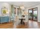 Charming dining room features a round table and French doors at 9004 Topwater Ln, Johns Island, SC 29455