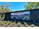 Rosebank Farms sign with vibrant flower field and tractor, showcasing Kiawah River location at 9004 Topwater Ln, Johns Island, SC 29455