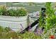 Elevated garden beds with various plants and flowers, showcasing a well-maintained landscape at 9004 Topwater Ln, Johns Island, SC 29455