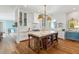 Bright kitchen features white cabinetry, marble countertops, and a large island at 9004 Topwater Ln, Johns Island, SC 29455
