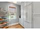 Bright pantry with ample shelving and built-in refrigerator at 9004 Topwater Ln, Johns Island, SC 29455