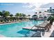 Resort style pool with plenty of lounge chairs and umbrellas at 9004 Topwater Ln, Johns Island, SC 29455