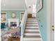 Stunning staircase with reclaimed wood treads and a modern handrail at 9004 Topwater Ln, Johns Island, SC 29455