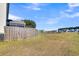 Backyard view of fence and open space with homes in the background at 108 Glenspring Dr, Summerville, SC 29486