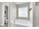Bathroom featuring a garden tub and a separate toilet area at 108 Glenspring Dr, Summerville, SC 29486