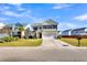 Two-story house with a beige exterior, a white garage door, and a landscaped front yard at 108 Glenspring Dr, Summerville, SC 29486