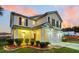 Two-story house with a beige exterior, a white garage door, and a landscaped front yard at 108 Glenspring Dr, Summerville, SC 29486