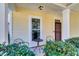 Small front porch with two metal chairs and a small table at 108 Glenspring Dr, Summerville, SC 29486