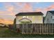Back of house with screened porch and wooden fence at 108 Glenspring Dr, Summerville, SC 29486