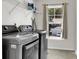 Laundry room with modern washer and dryer, shelving, and a window at 108 Glenspring Dr, Summerville, SC 29486