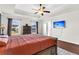 Main bedroom with king bed, hardwood floors, and a wall-mounted TV at 108 Glenspring Dr, Summerville, SC 29486