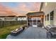 Back patio with fire pit, grill, and screened porch at 108 Glenspring Dr, Summerville, SC 29486