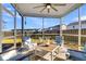 Relaxing screened porch with seating and ceiling fan at 108 Glenspring Dr, Summerville, SC 29486