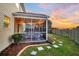 Screened porch with seating area and string lights at 108 Glenspring Dr, Summerville, SC 29486