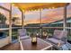 Cozy screened porch with seating and sunset view at 108 Glenspring Dr, Summerville, SC 29486