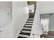 Elegant staircase with dark wood steps and white railings at 108 Glenspring Dr, Summerville, SC 29486