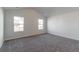 Bright bedroom with grey carpet and two large windows at 122 O'Leary Cir, Summerville, SC 29483