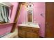 Bathroom with vanity and pink walls at 1269 College Park Rd, Summerville, SC 29486