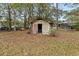 A dilapidated storage shed sits in the backyard, needing significant work at 1269 College Park Rd, Summerville, SC 29486