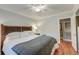 Main bedroom with hardwood floors, ceiling fan, and walk-in closet at 1407 Fairfield Ave, Charleston, SC 29407