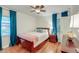 Bright bedroom with full-size bed and teal curtains at 1407 Fairfield Ave, Charleston, SC 29407