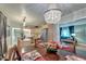 Bright dining room with a chandelier, wooden table, and kitchen view at 1407 Fairfield Ave, Charleston, SC 29407