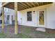 Rear exterior of townhouse showing white siding, door, and window at 2002 Quiet Ibis Rd, Hanahan, SC 29410