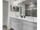 Double vanity bathroom with white cabinets and gray tile shower at 2008 Quiet Ibis Rd, Hanahan, SC 29410