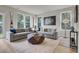 Bright living room featuring gray sofas and large windows at 2008 Quiet Ibis Rd, Hanahan, SC 29410