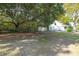 Large backyard with mature trees and a detached garage at 3260 Cohen Hill Rd, Johns Island, SC 29455