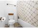 Small bathroom with shower/tub combination and patterned curtain at 3260 Cohen Hill Rd, Johns Island, SC 29455